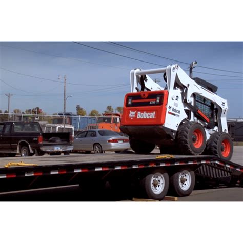 how to transport a skid steer|securing skid steer on trailer.